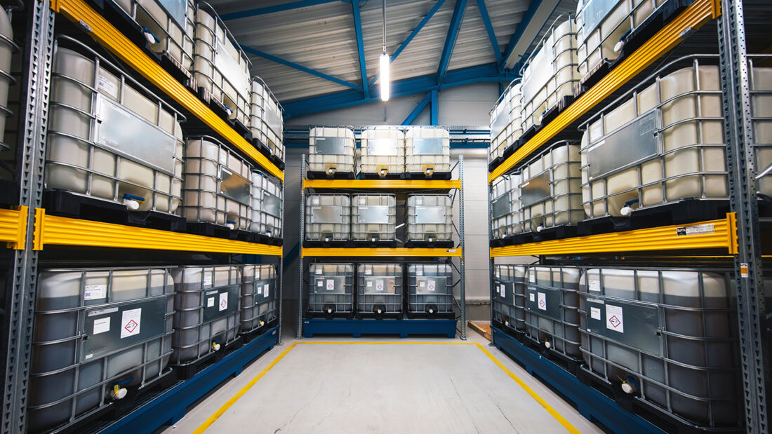 Warehouse with containers for liquid rhamnolipids